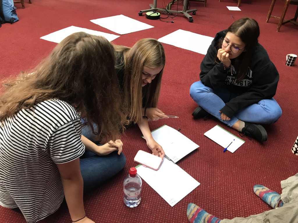 Volunteers writing their script